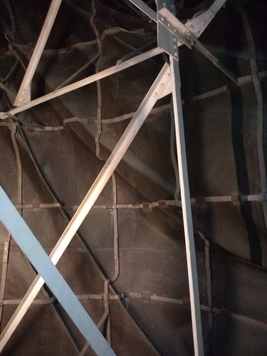 Close up photo of the inside of the Statue of Liberty featuring part of the framework. 