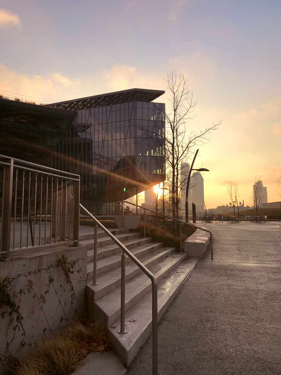 Photo of the Bloomberg Center at Cornell Tech seen shortly after sunrise, facing east