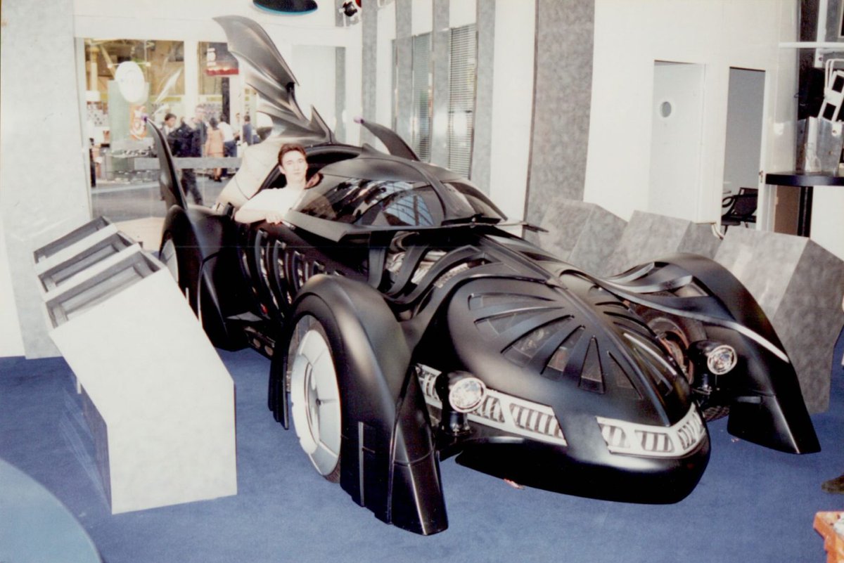 3FieldsEnt's tweet photo. You couldn't make this stuff up - the actual #Batmobile from #Batman Forever and a bit 'comes off in his hand'. A very young looking Alex risks getting fired for the ultimate selfie #Alexblogs #ECTS #videogames https://t.co/RLJFcQO7CP https://t.co/IBn1trKUj5