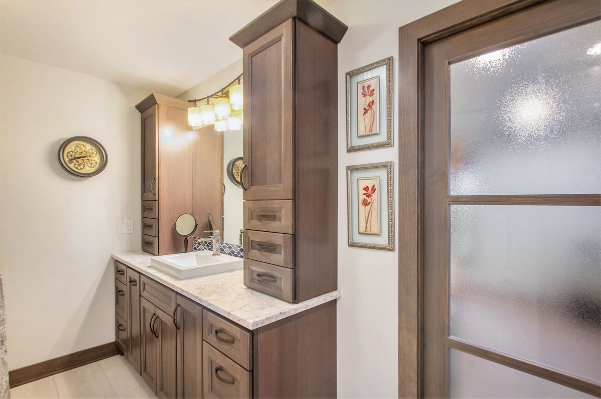 Remodeled #MasterBathroom.
_
Master bathroom features new vanity and linen storage cabinets, soaker-tub/shower with 3-piece composite marble shower wall surround and heated tile floor. #remodeler #GrandRapids