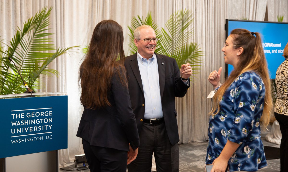 President LeBlanc speaking with two alumnae 