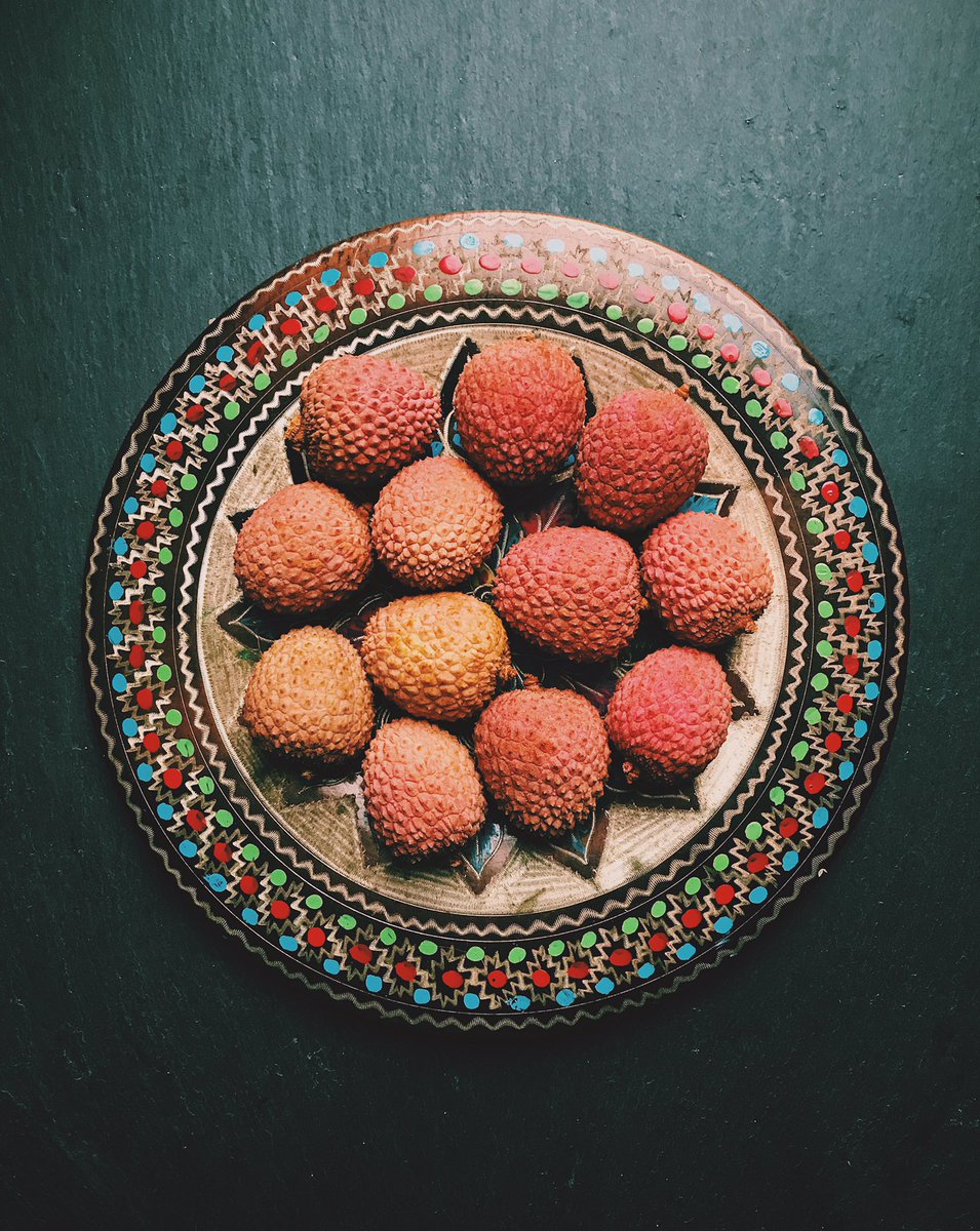 Lychees on a plate on a slate #lychees #vintageplate #vscofood #iphone