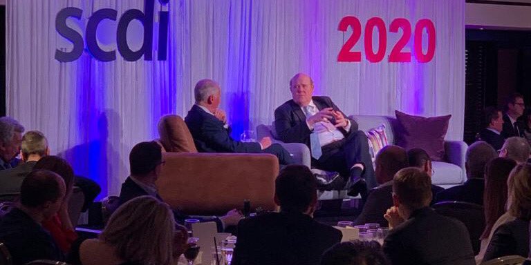 Rupert Soames discussing the role of <a href="/SercoGroup/">Serco Group</a> and its reach to a packed #SCDILecture2020 audience.