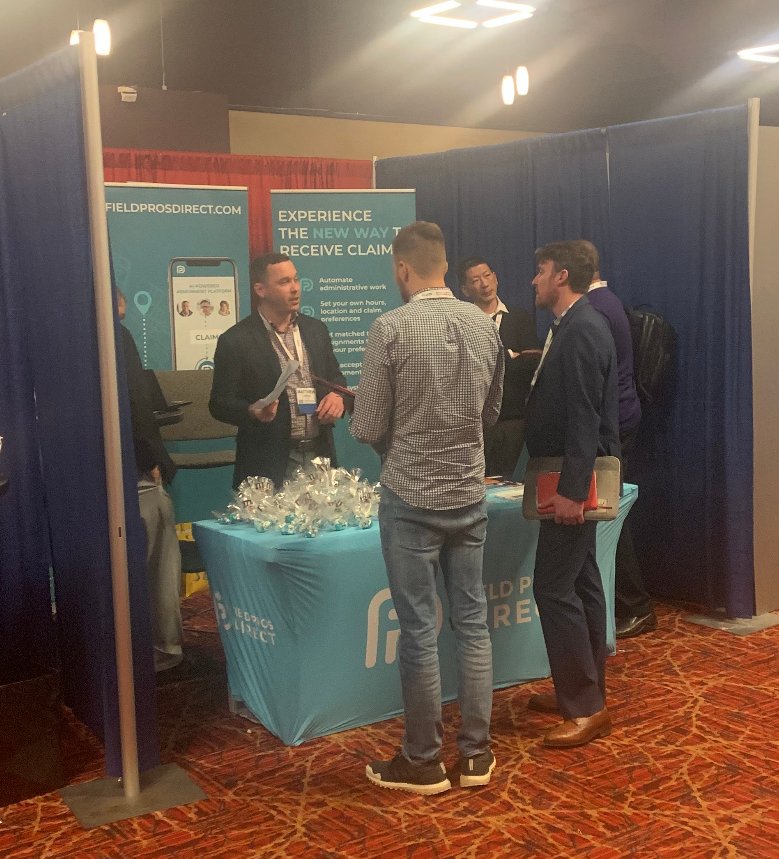 FieldProsDirect's tweet image. Matt Cronican chatting with adjusters at NACA. Stop by to say "Hi!"