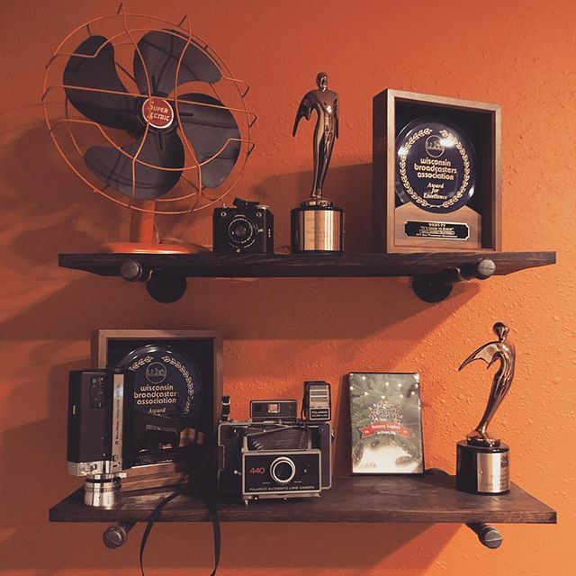 elevatemginc's tweet photo. Wow artsy symmetrical picture of a random shelf in our office. #awards #oldcameras https://t.co/mDsESgivtD https://t.co/eWPxxobaAk