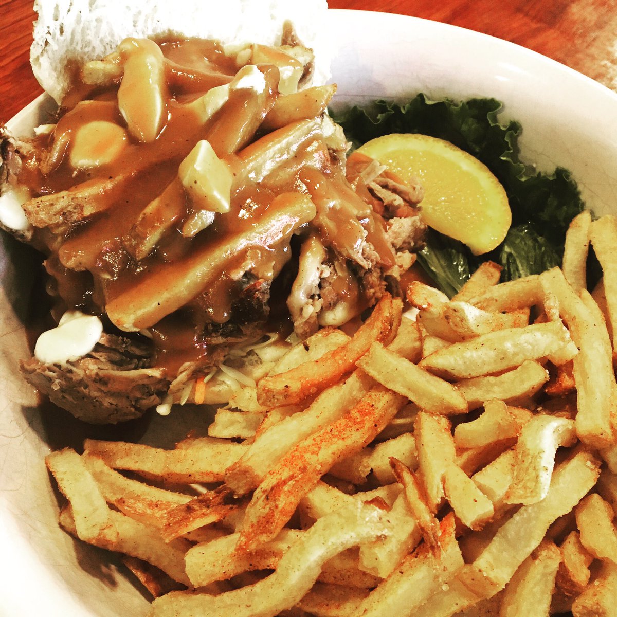 station_bbq's tweet photo. Our Fri/Sat lunch feature this week is the Pigpen Poutine Sammich. Juicy pulled pork, topped with hand-cut, double-cooked fries, cheese curds, and our house-made gravy. Served on a soft white bun or griddlebread. It’s hot and messy, but it’s just the hot mess you need right now. https://t.co/vhyvBt5WzN