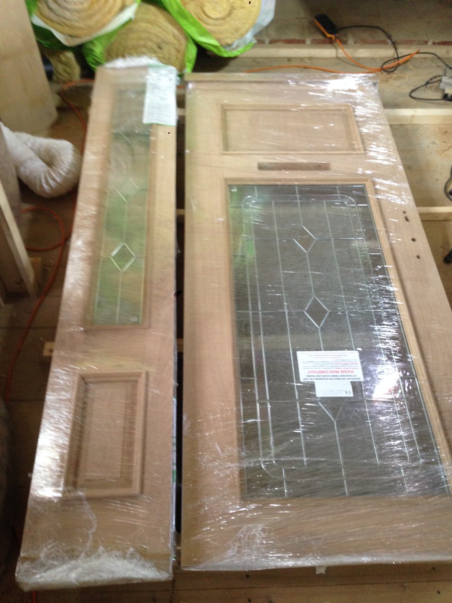 RoyAndTanya's tweet photo. #Renovation day spent unwrapping, sanding and first coat of Sadolin to our beautiful fitted @DistinctDoors front door set. V difficult to coat all surfaces at same time so spinning frame made. 3 more coats to go. Humpf. https://t.co/QvUsDqDSaS
