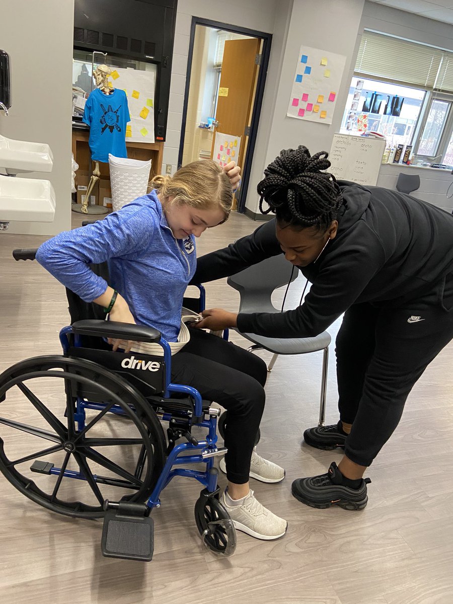 SDEmedhealth's tweet photo. Another great skills lab! Thank you, Heather, for coming in to engage and inspire our students. They learned how to transfer patients from wheelchairs to chairs! #engage #inspire @launch_sde @launch_tosa @BEHS_SDE @BCHS_SDE https://t.co/KHAFtKXvHb
