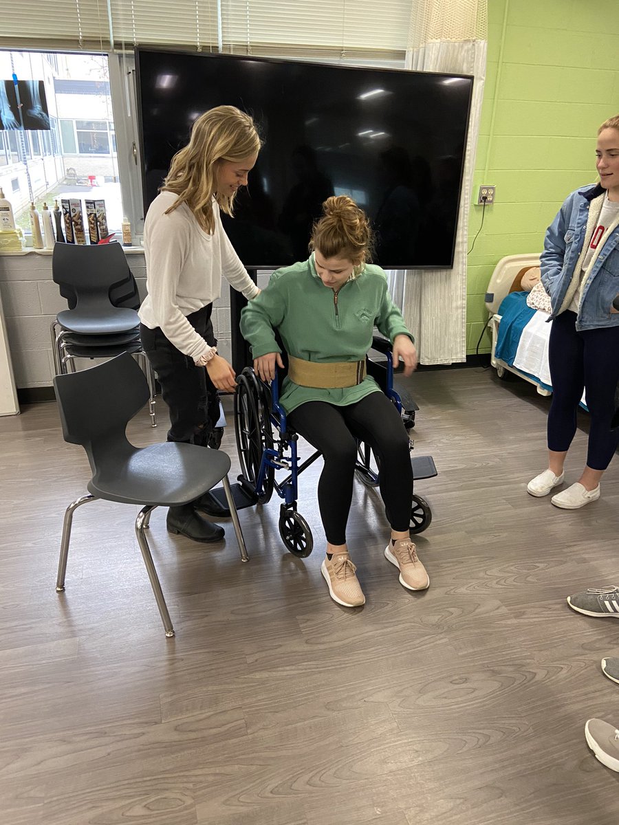 SDEmedhealth's tweet photo. Another great skills lab! Thank you, Heather, for coming in to engage and inspire our students. They learned how to transfer patients from wheelchairs to chairs! #engage #inspire @launch_sde @launch_tosa @BEHS_SDE @BCHS_SDE https://t.co/KHAFtKXvHb
