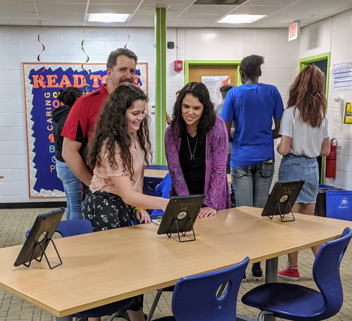 plazamiddle's tweet photo. Grade 8 Eng students display their final products to an audience at the Community Showcase. Ss conducted interviews and composed essays that describe an influential person in their lives to learn how one's identity is formed through character and setting.  #IBelieveIcan @ibmyp https://t.co/gtUa00cnpq