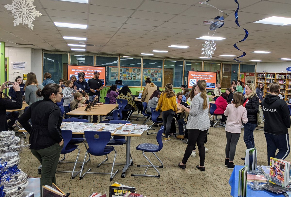 plazamiddle's tweet photo. Grade 8 Eng students display their final products to an audience at the Community Showcase. Ss conducted interviews and composed essays that describe an influential person in their lives to learn how one's identity is formed through character and setting.  #IBelieveIcan @ibmyp https://t.co/gtUa00cnpq