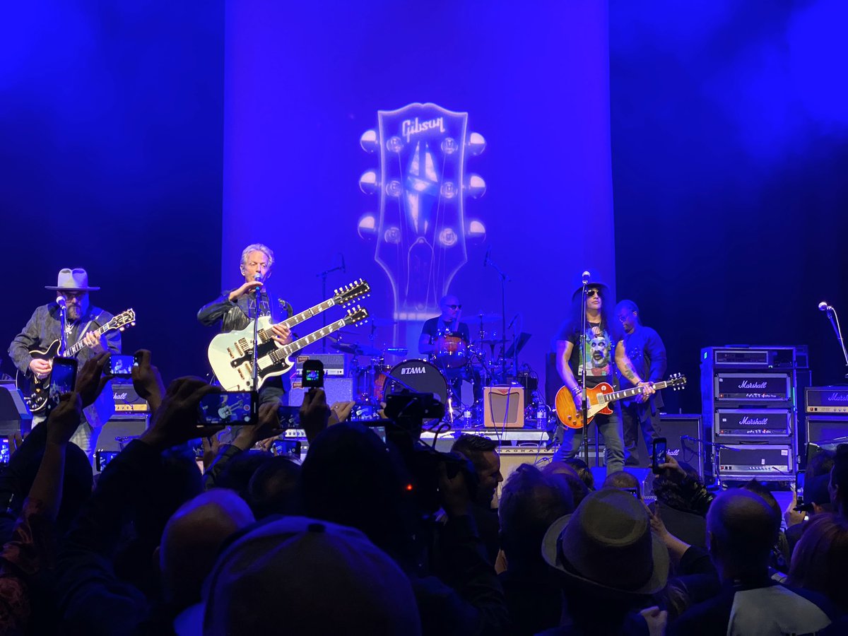 _thomtran's tweet photo. Tonight @gibsonguitar #NammJam 2020, I saw @Slash play “Hotel California” w/ @donfelder from the Eagles, the Right Reverend Billy Gibbons got on stage with Jimmy Vivino, Slash & Rick Neilsen (from @cheaptrick) & it was all hosted by @JohnStamos. Yup. Uncle Jessie. WTF is my life? https://t.co/UkYzo8GXN8