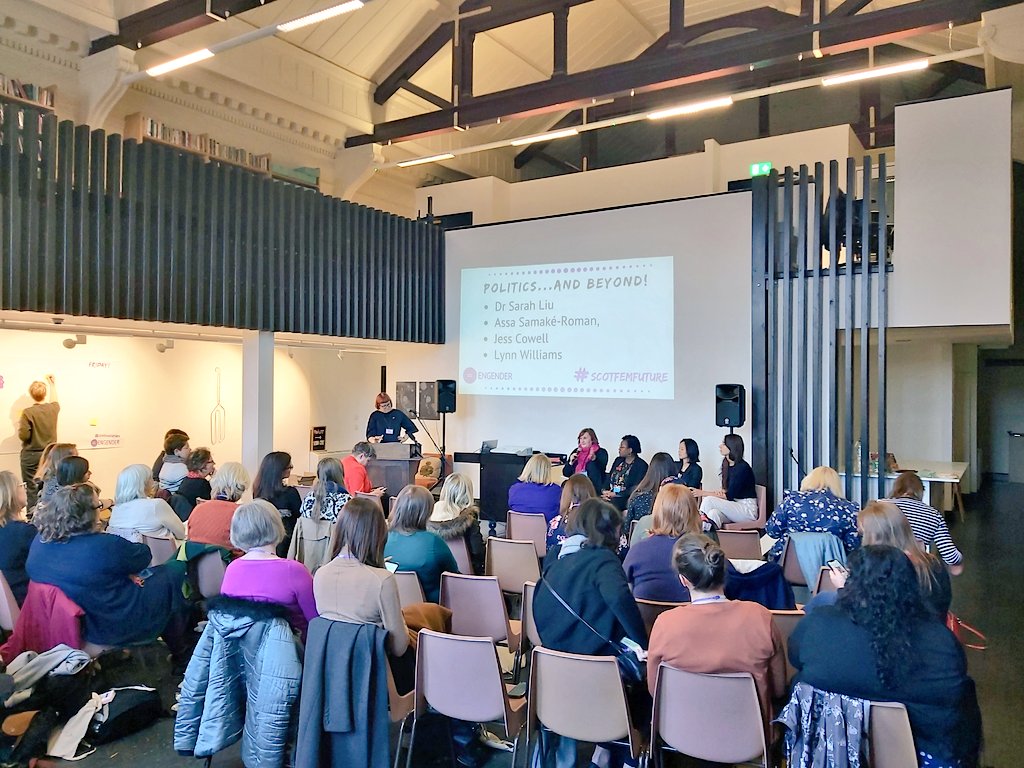 Women listening to a panel of women speaking about politics and underrepresented women at Glasgow Women's Library.