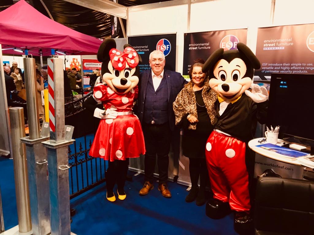 WorldofESF's tweet photo. ESF's Paul and Elaine had a couple of very special visitors to our stand today at the Holiday World Show in @TECBelfast.
They seemed quite keen on finding out more about ESF Security's range of products! #WorldOfESF #ESFSecurity #HolidayWorldShow #Disney #MickeyAndMinnie https://t.co/6ZyyRGx2eW
