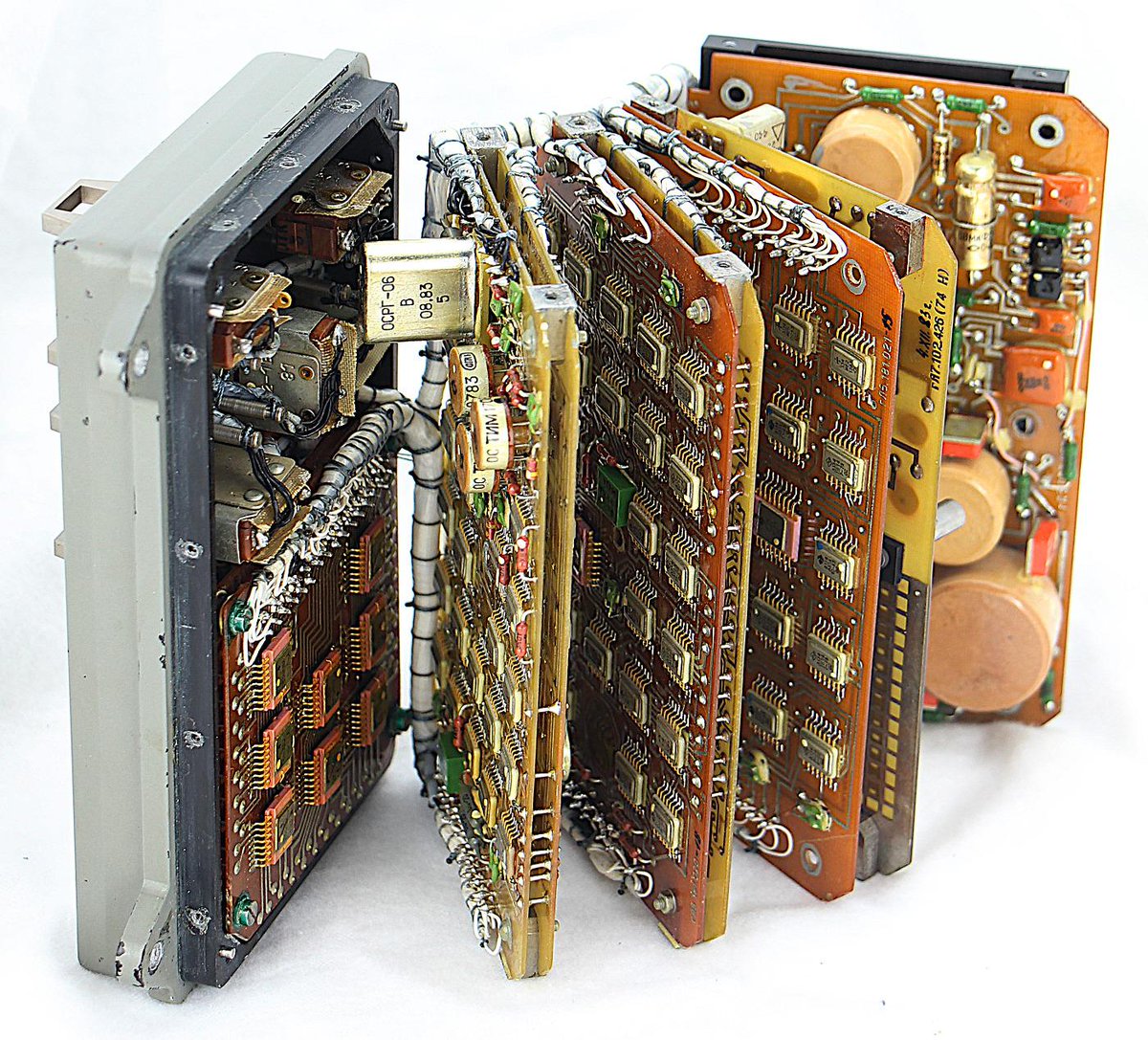 The clock opened up. The circuit boards are fanned out, showing the circuitry inside the clock.