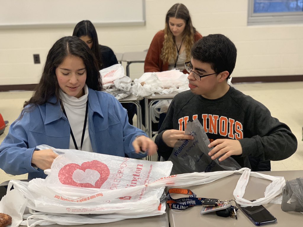In Today’s meeting we made strips of plastic which would be later on made into plastic-blankets and given out to the people in need.
