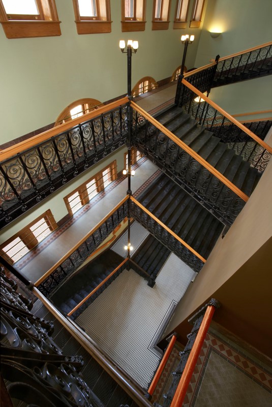 OldRedMuseum1's tweet photo. Did you know our grand staircase was almost completely removed in the 1920s to make room for more office space? The photo on the left shows the staircase area when museum renovations began. The photo on the right shows our restored grand staircase today. https://t.co/B9UYn2BpPv