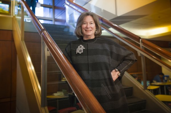 Dean Barbara Boyan standing on a stairway