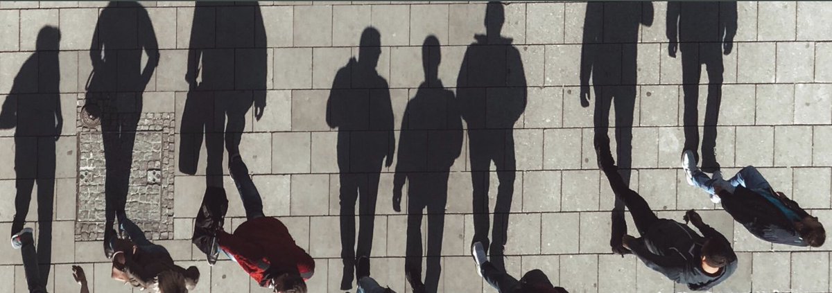 Detail of report cover, photo of people and their shadows by Jan Kolar on Unsplash