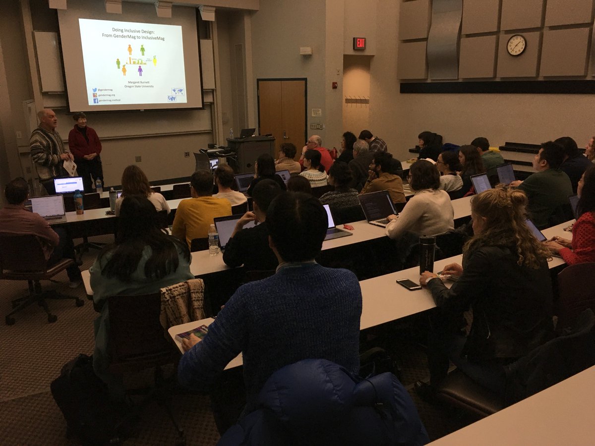 an audience watching a presentation