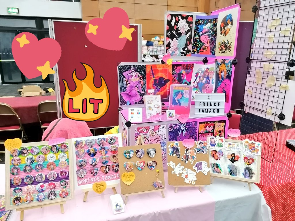 My table set up for akumakon!! Got some new products like Beastars & Promare badges and fire emblem & goose stickers!! Hope to see you!! ?✨?✨ 