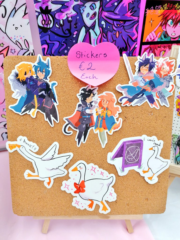 My table set up for akumakon!! Got some new products like Beastars & Promare badges and fire emblem & goose stickers!! Hope to see you!! ?✨?✨ 