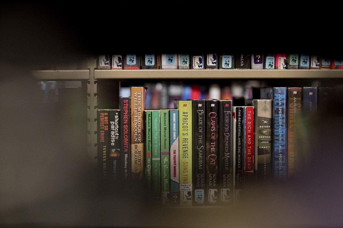 Close-up shot of a bookshelf in the fiction section