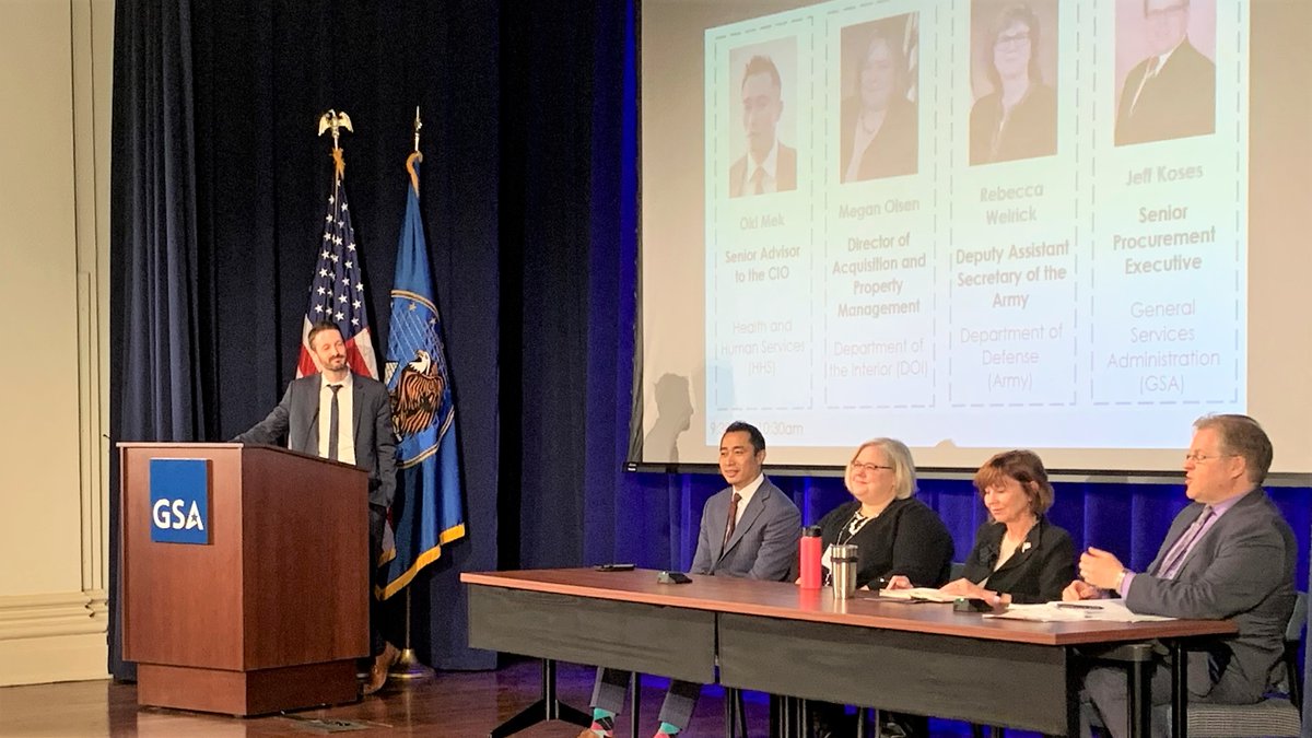 photo of the panelists at the event, onstage