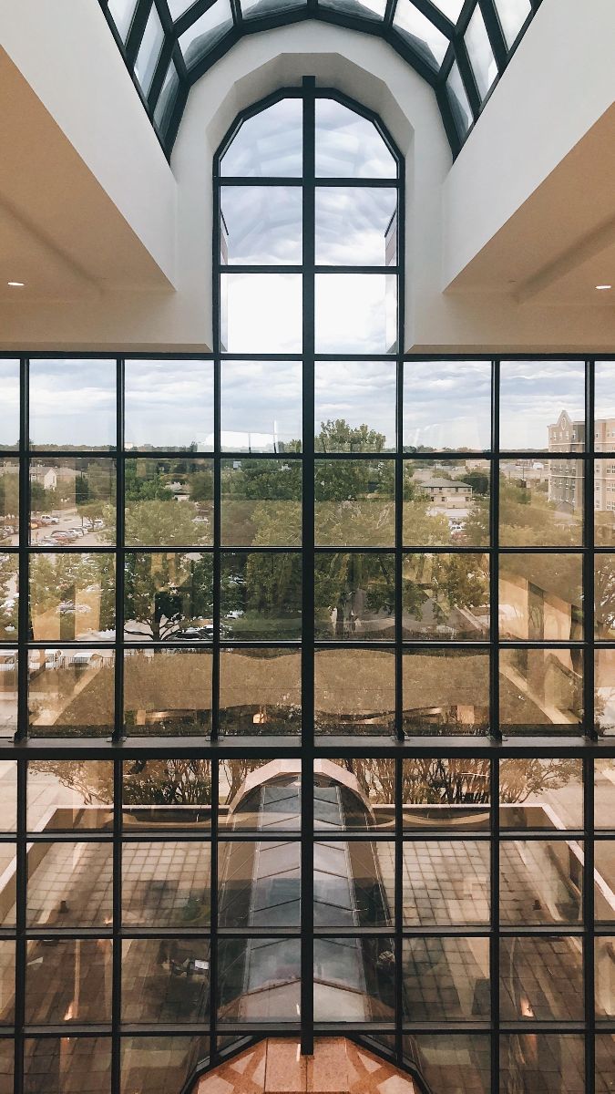 Inside the Louise Herrington School of Nursing, looking out its large window.