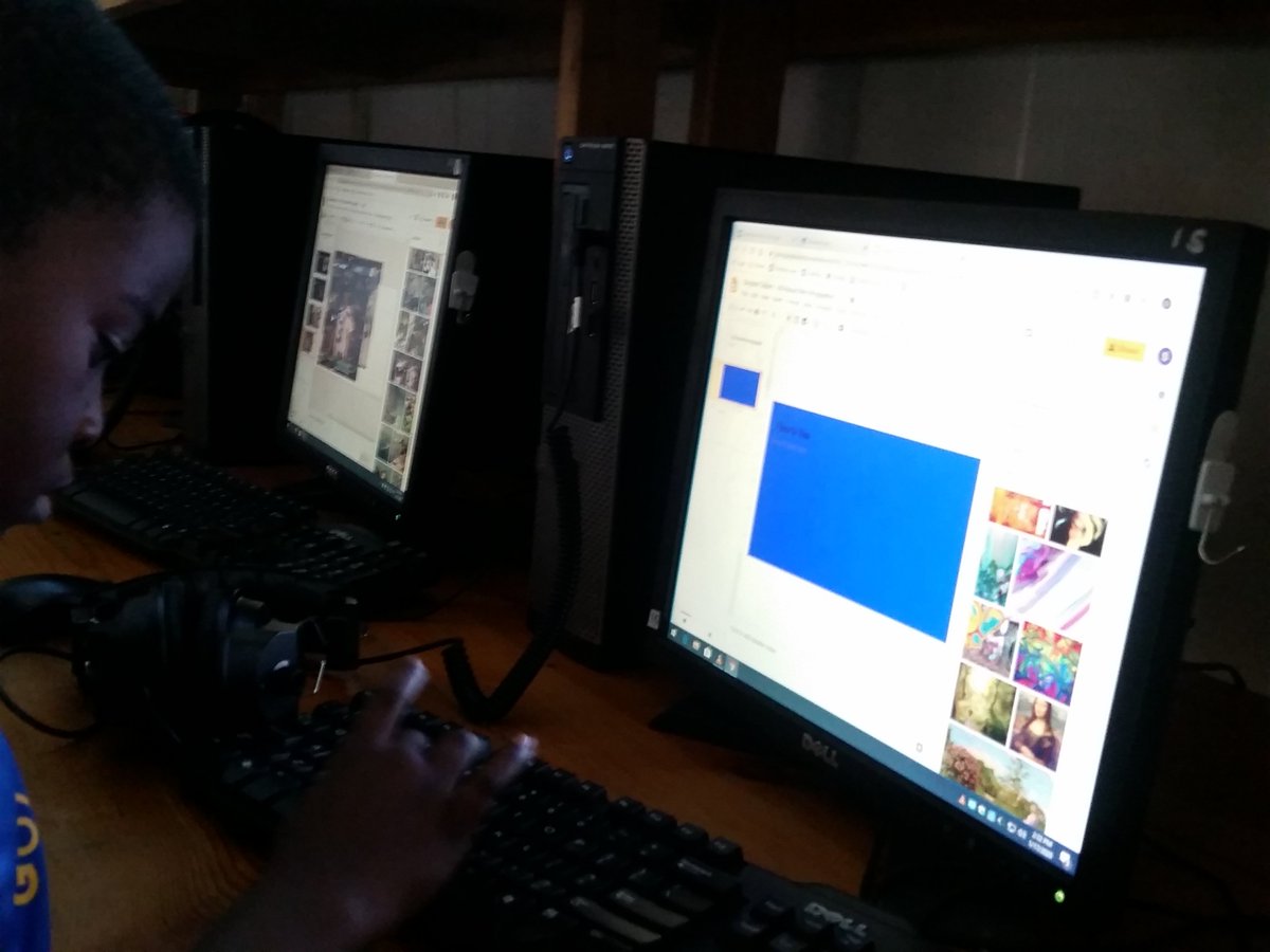 2nd Grade making a slide show about themselves then reading.