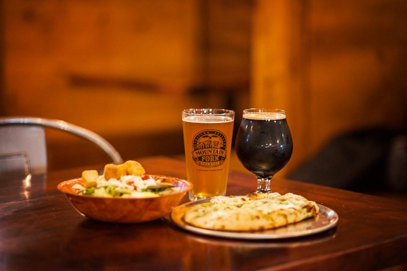 TravelOK's tweet photo. After a long day exploring Broken Bow and Beavers Bend State Park in southeast Oklahoma, relax with a local beer and some beautiful scenery at Mountain Fork Brewery! Sit outside on their gorgeous porch and find your new favorite pint! https://t.co/9EniNxxJ2X https://t.co/iSp2mjd6uR