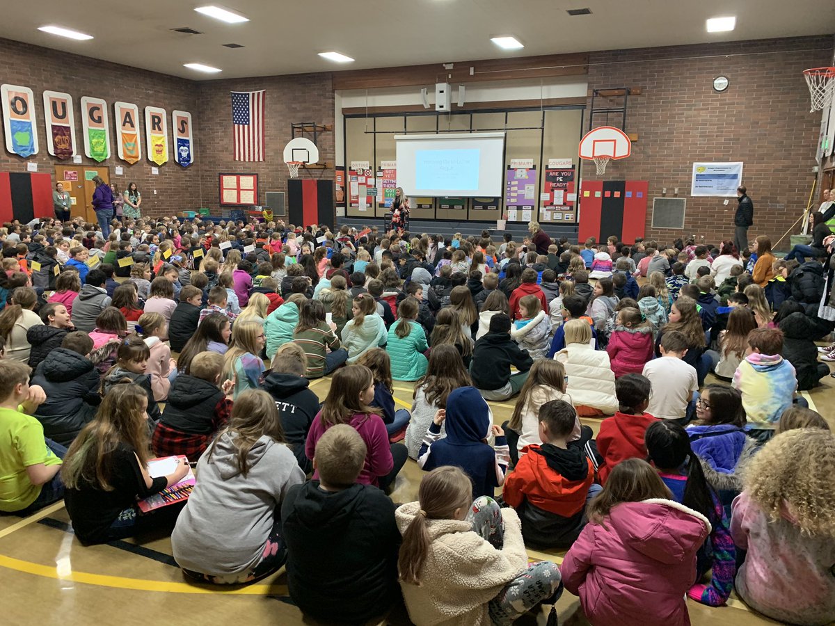 MarciShepard's tweet photo. K-3 students at Orting Primary School are sharing their learning about #MLK at their Dr. MLK Jr assembly. They bring an important #StudentVoice in their own “I have a dream” speeches as well as poems and songs. #OrtingCares https://t.co/Nh1MKaxrNM
