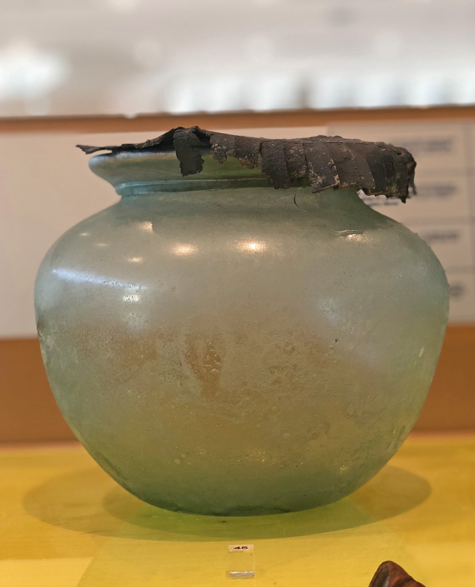 OptimoPrincipi's tweet photo. A Roman glass cinerary jar (olla) with its original lead lid. 2nd century AD, Narona Archaeological Museum #RomanDeath #Croatia https://t.co/1yDbG91ZJ4
