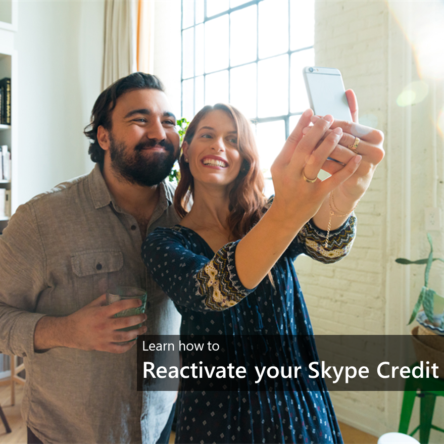 Man and woman hold mobile phone