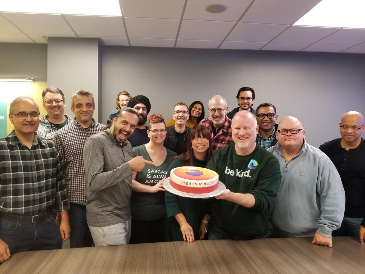 several teammates on the Edge team with the Firefox cake