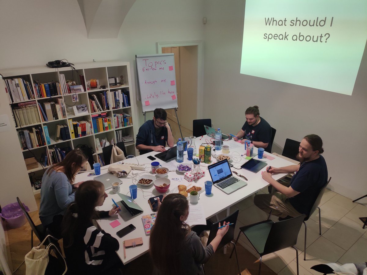 A group of people having a discussion around a table