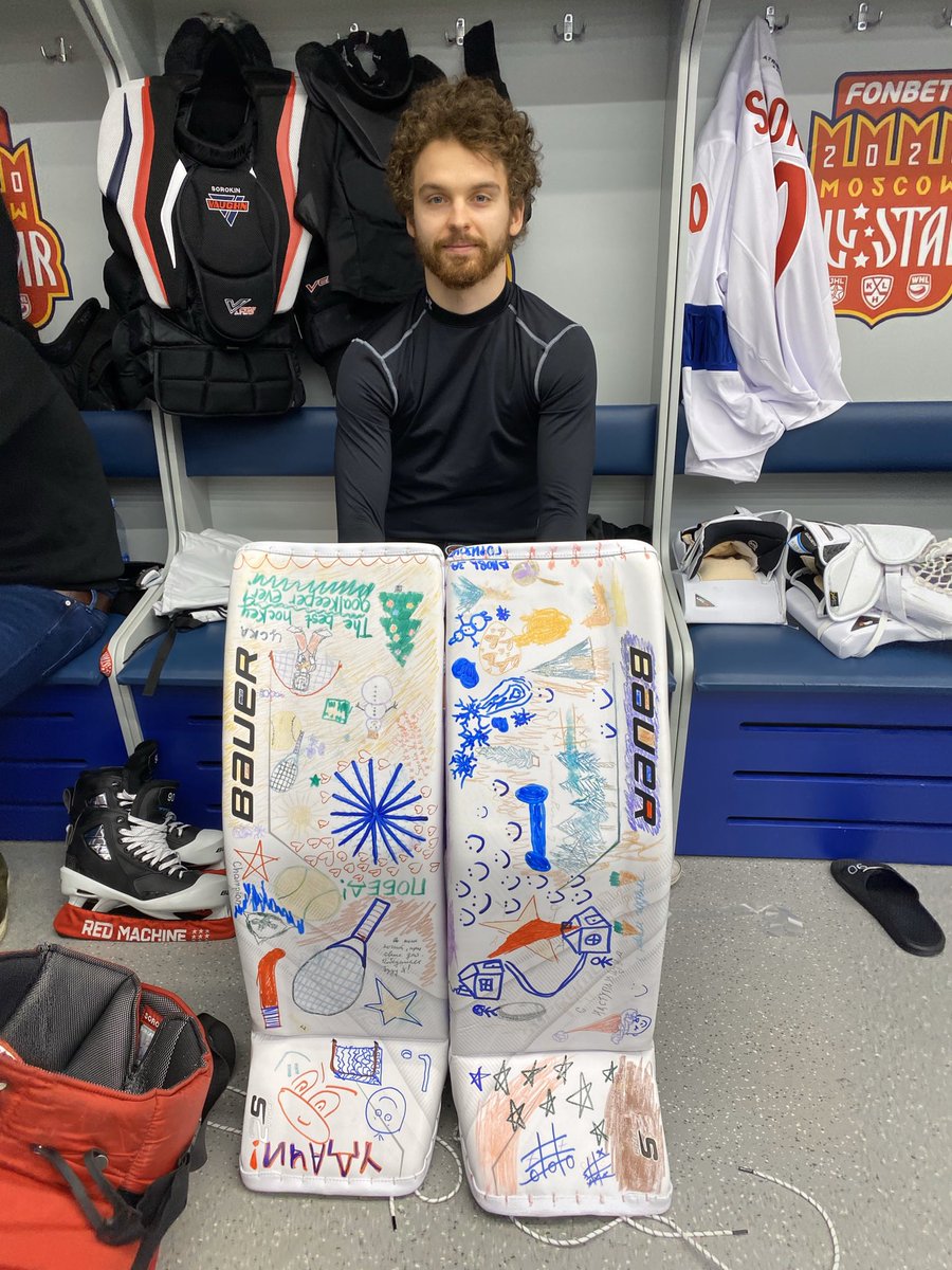 Ilya Sorokin poses with his pads for me, decorated by children at the pediatric institute. They will go to auction after the game as a fundraiser for Vilen Prokofyev, a young Kazakh goaltender who fights cancer. <a href="/hccska/">ХК ЦСКА Москва</a> #KHLAllStars #isles