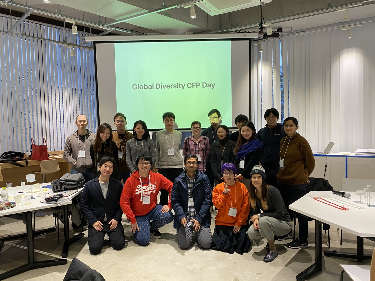 Group photo in front of a "Global Diversity CFP Day" backdrop slide.
