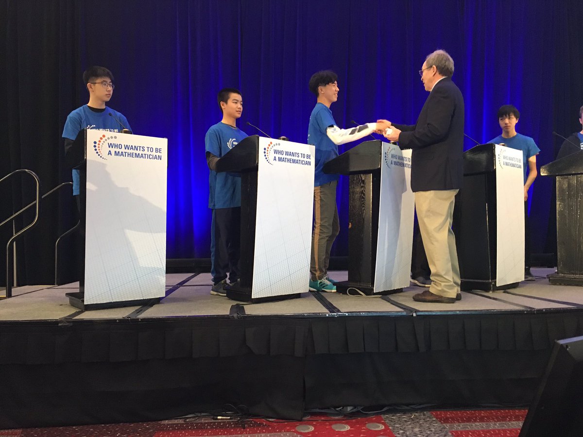 amermathsoc's tweet photo. Who Wants to be a Mathematician host Mike Breen congratulates the contestants of game 1 at #mathematicon #JMM2020 @JointMath https://t.co/K3U13oWBLp