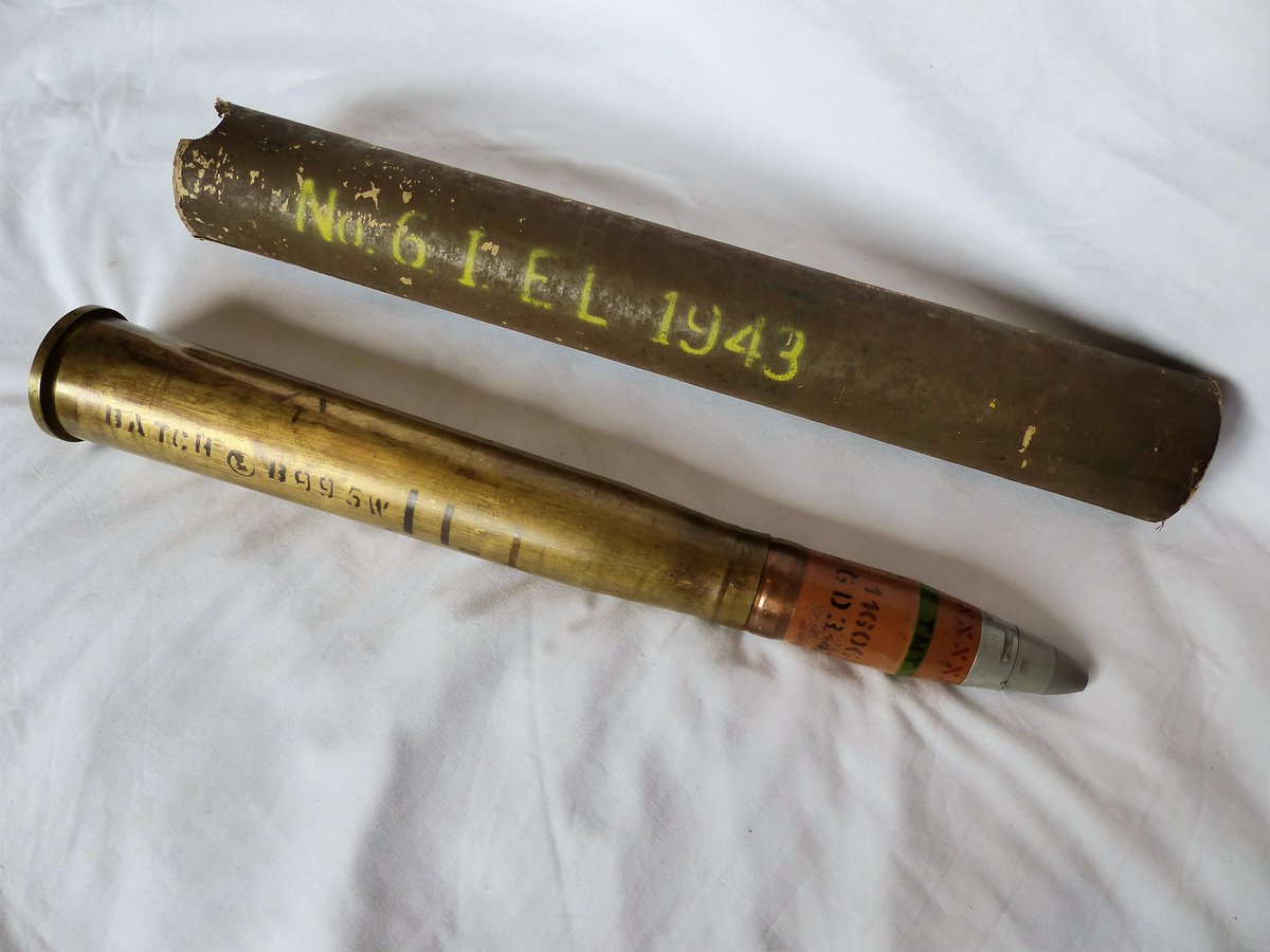 WW2Ordnance's tweet photo. Today's #inertordnance picture is a British #WW2 40mm L60 Bofors HE round with the hard to find cardboard packing tube. Paint and stencils are all original on the brass case and projectile, fuze is a No251. https://t.co/X6mK2KjciB
