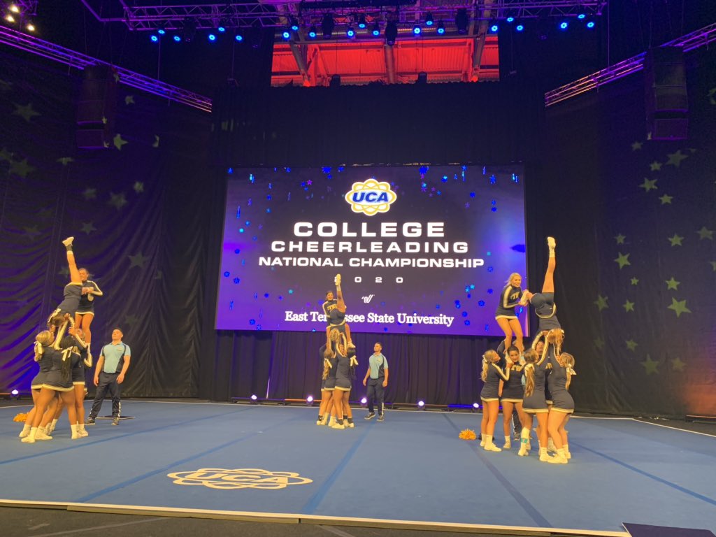 UCAupdates's tweet photo. We are loving all these top notch performances we are getting in All Girl Division I finals!💛💙📣 #UCAnationals https://t.co/D7yKOmi1QS