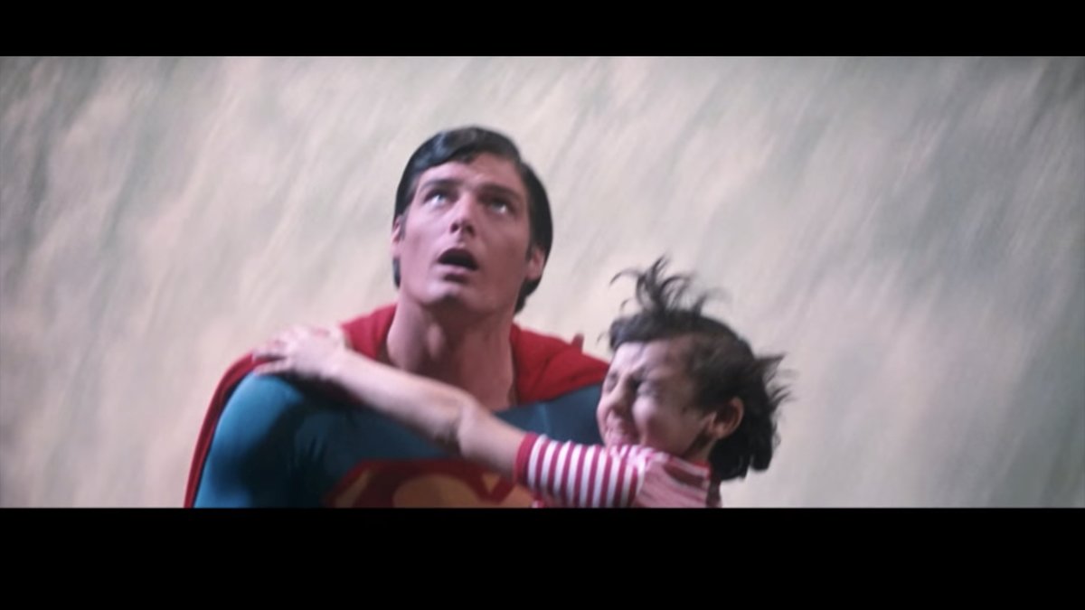 Superman manages to reach the boy just as the boy is inches away from certain death.