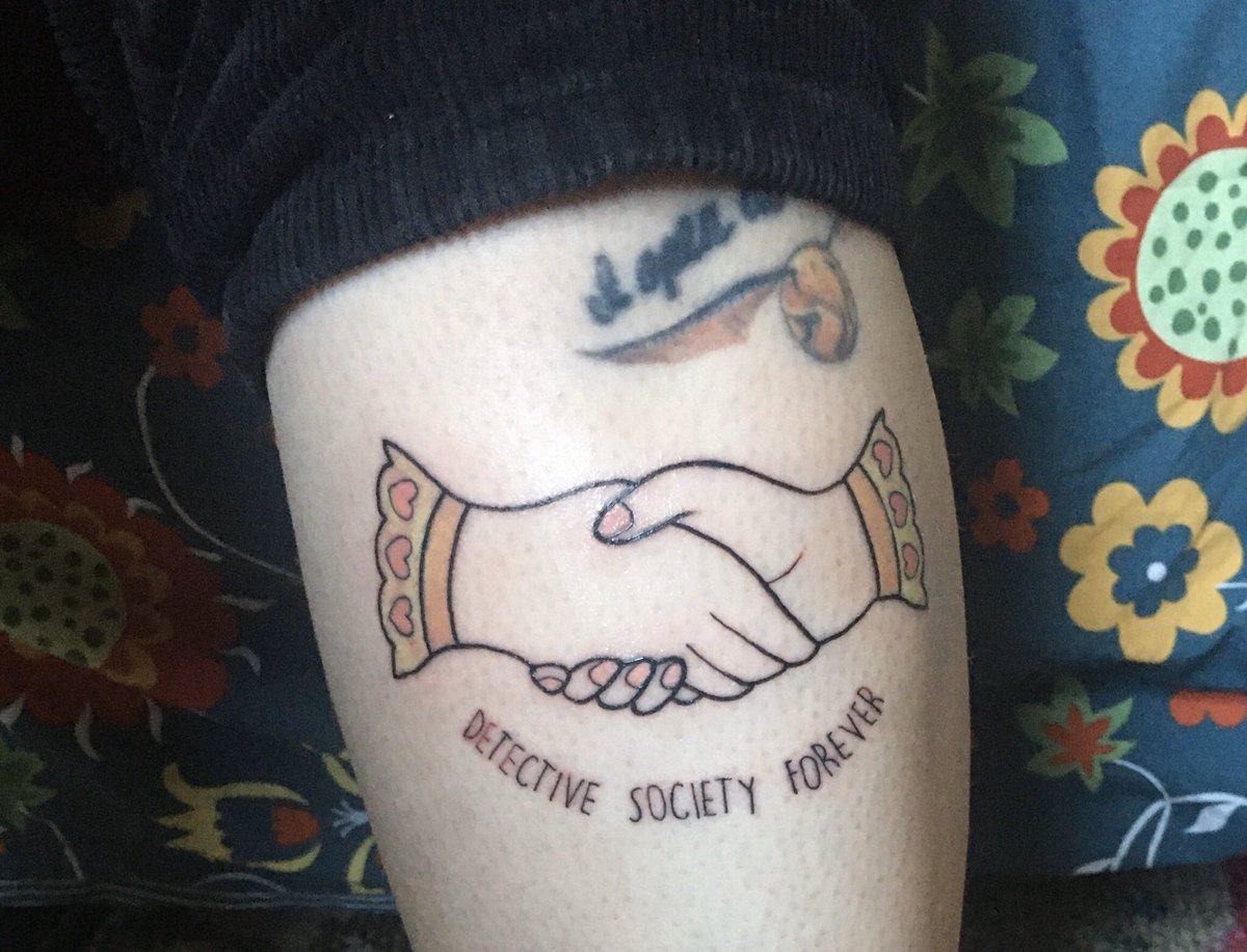 grrrlbrarian's tweet photo. It’s still extremely sore but my new tattoo is done! In tribute to my fave series ending this year, Murder Most Unladylike by @redbreastedbird 💖 https://t.co/3pyMcOAZvD