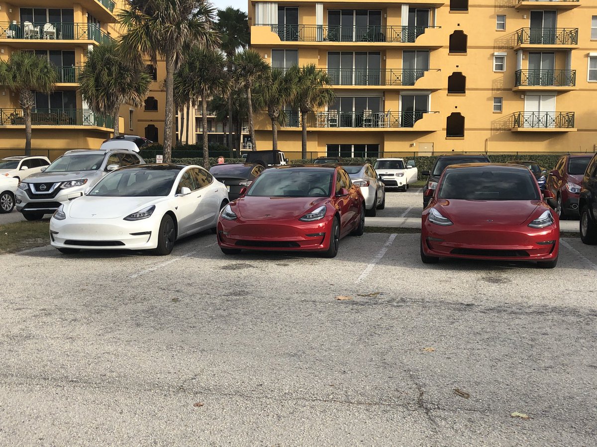 ChadLuttrull's tweet photo. The @Tesla #Model3’s are out in full force for the @SpaceX launch this morning. Over 10 in the parking lot. https://t.co/NLi0vtL8iQ