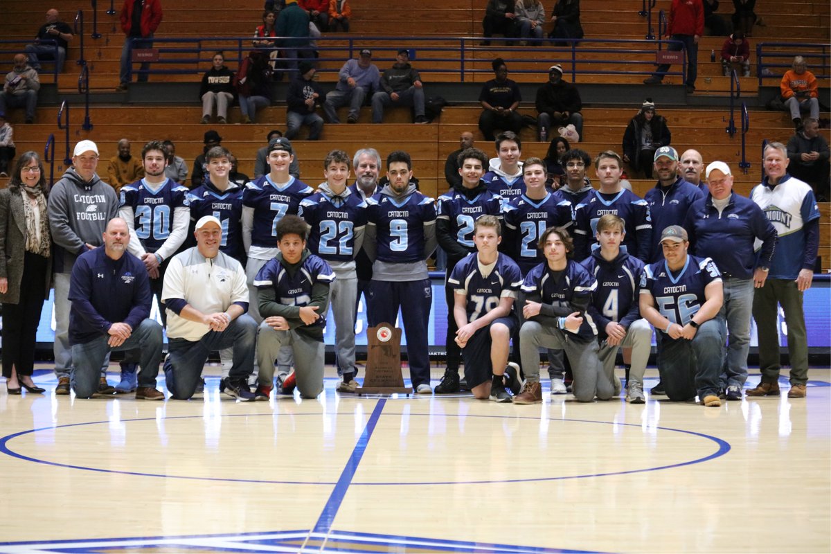 MSMU's tweet photo. Recognizing the @CatoctinPigSkin state 1A champion football team at yesterday's men's basketball game. Congratulations on your outstanding 2019 season and thanks for cheering us on to a win over Central Connecticut! #CompeteFerociously #CougarPride https://t.co/SuUDvAmOcR