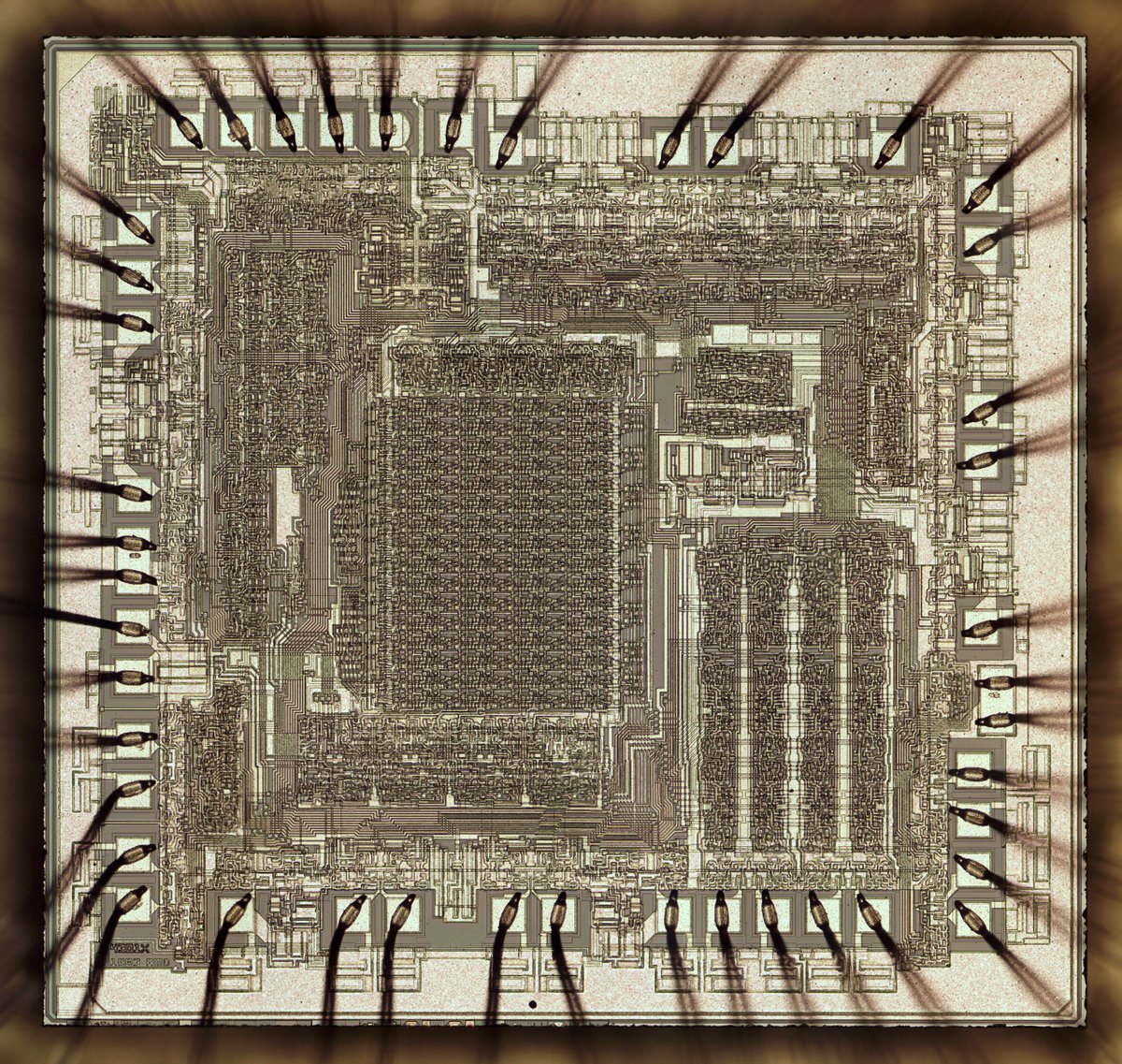 Die photo of Am2901 chip. The bond wires are connected to pads around the chip.