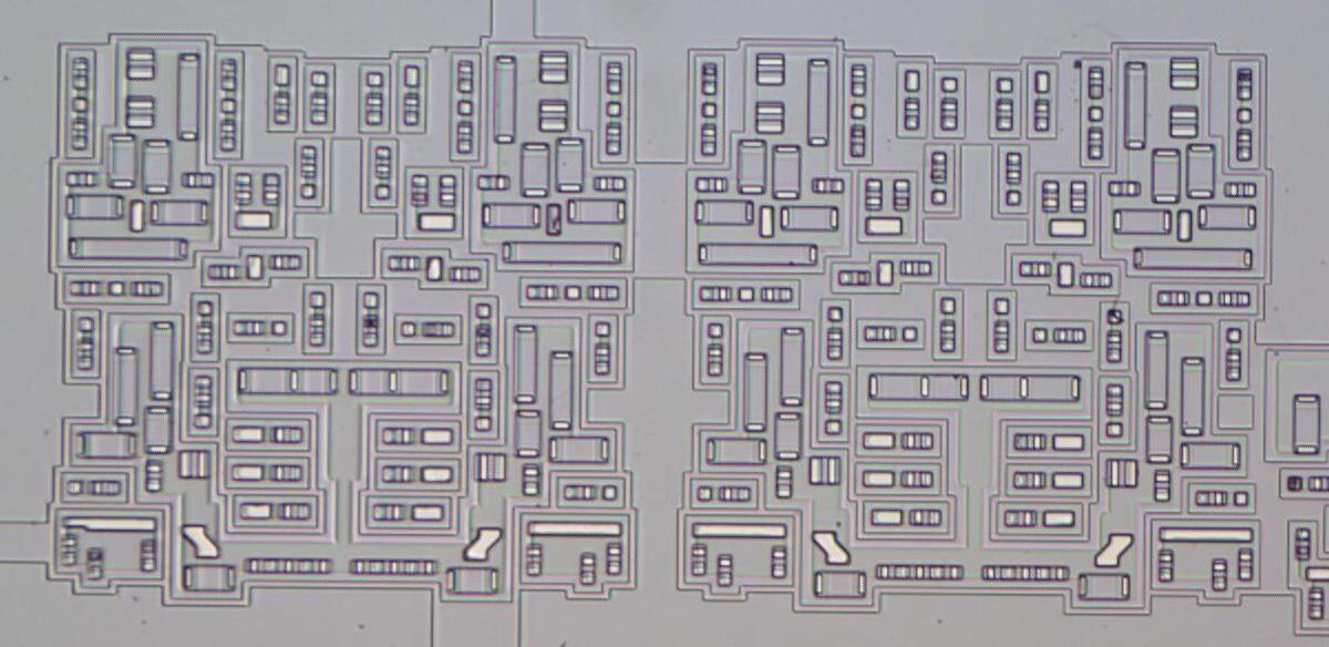 Detail of die photo showing many transistors. They appear as a complex pattern of rectangles.