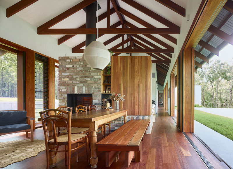 Louver windows and sliding doors keep the #interiors of this #luxuryhome cool by allowing in a breeze.  cpix.me/a/90262985