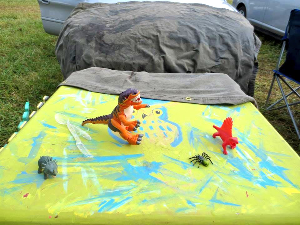 This is the table that my Bonnaroo neighbors snorted lines off of. You can see the nest I built to sleep under. Roo is fuckin' hot and it made for good shade!The bloody baby backpack was my free candy dispenser. I jammed suckers into its head then let strangers pluck them free.