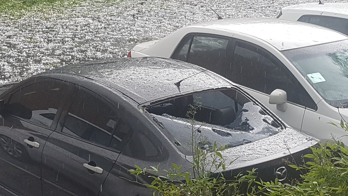 Drought, fire, now hail! Glasshouses destroyed at ANU, every car in the carpark totalled.